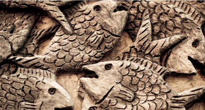 carved wooden fish relief